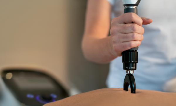 Effect of Radial Extracorporeal Shock Wave Therapy on Pain Intensity, Functional Efficiency, and Postural Control Parameters in Patients with Chronic Low Back Pain: A Randomized Clinical Trial