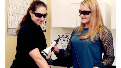 clinician applying laser to patient inner elbow