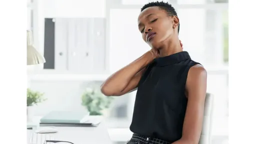 woman rubbing her neck