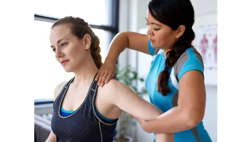 clinician moving patient arm
