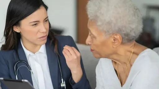doctor talking to older woman