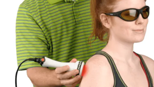 clinician using laser on patient shoulder