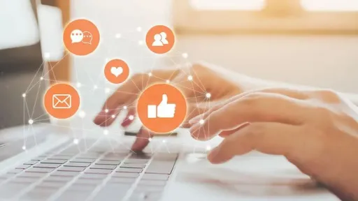 hands typing on a keyboard with social icons flying above them