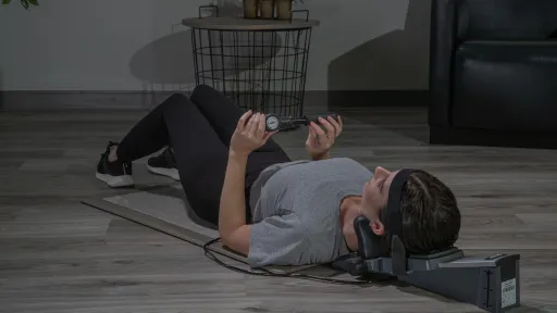 woman laying down using saunders cervical traction device